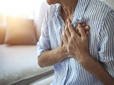 a man feeling pain in chest