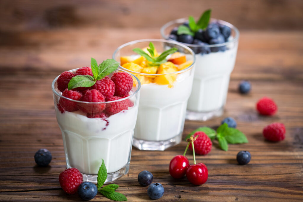 Fresh fruit yogurt with fresh berries and peaches