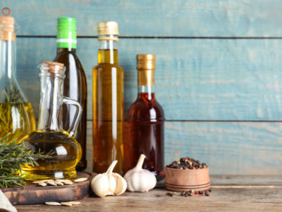 Image of jars of cooking oils, including olive oil, avocado oil, flaxseed oil, and others